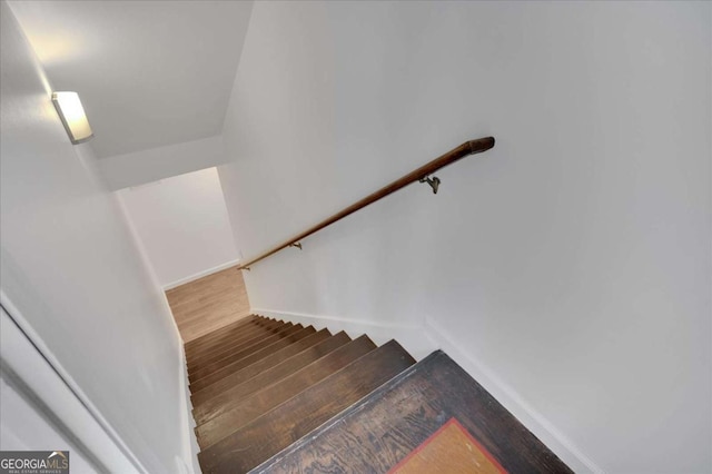 staircase featuring hardwood / wood-style flooring