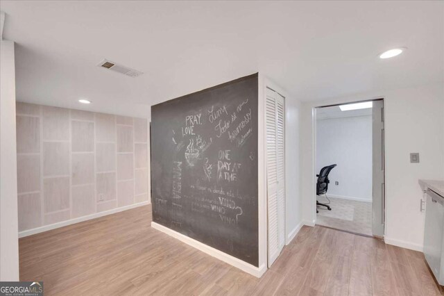 hallway with light wood-type flooring