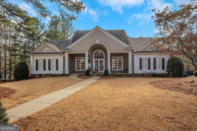 view of front of house featuring french doors and a front yard