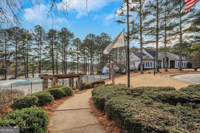 view of home's community featuring a pergola