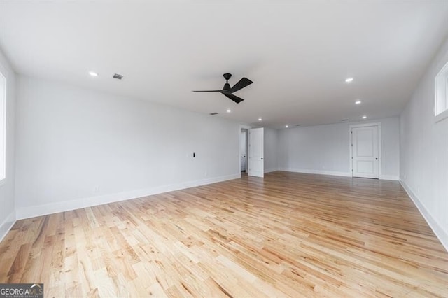 empty room featuring ceiling fan and light hardwood / wood-style floors