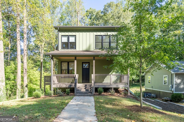 view of front of house featuring a porch and a front yard