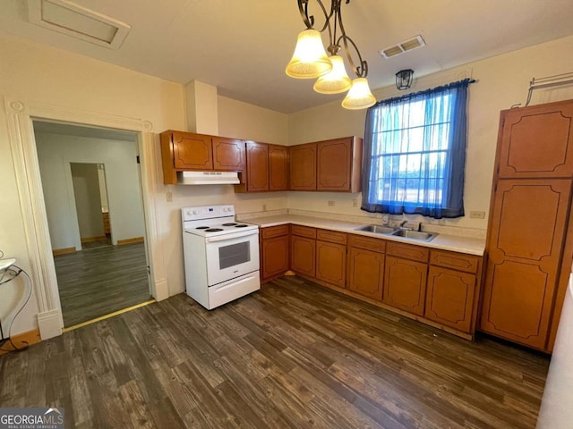 kitchen with sink, hanging light fixtures, white electric range oven, and dark wood-type flooring