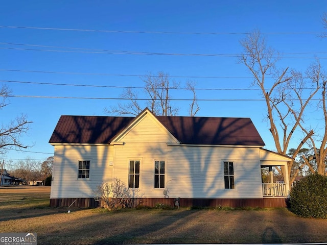 view of side of home with a porch