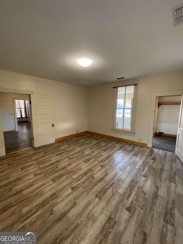 empty room featuring hardwood / wood-style flooring