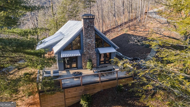 back of property with a wooden deck