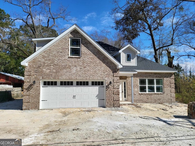 view of front of home featuring brick siding and an attached garage