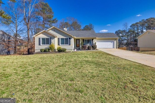 ranch-style home with a front lawn and a garage