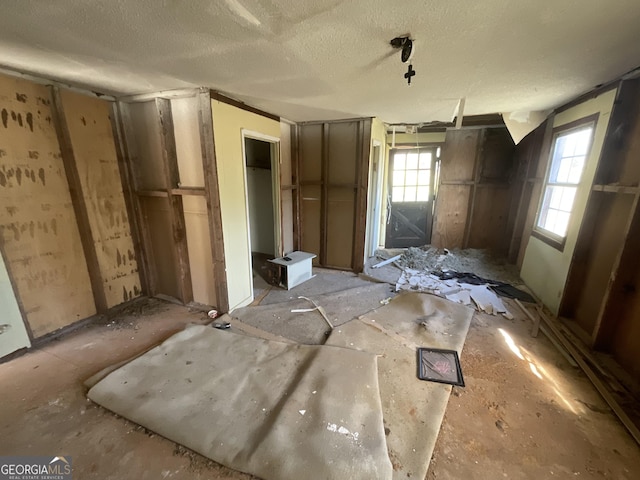 miscellaneous room featuring a textured ceiling