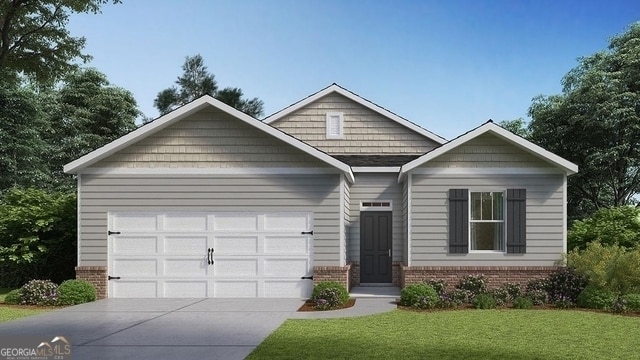 view of front of house with a garage and a front lawn