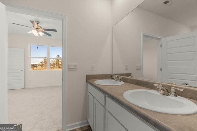 bathroom featuring ceiling fan and vanity