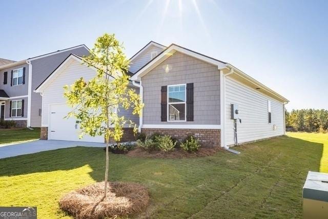 view of property exterior with a garage and a yard