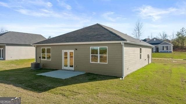 back of house featuring a patio area, french doors, and a yard