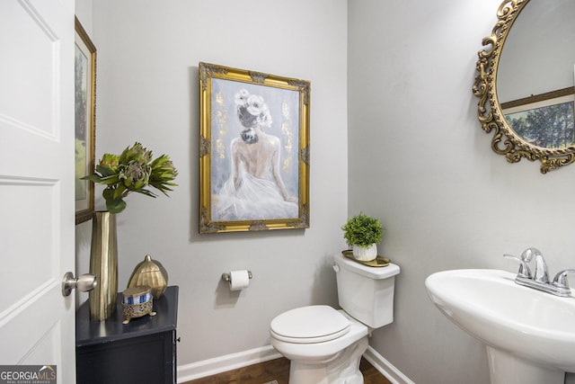 bathroom featuring sink and toilet