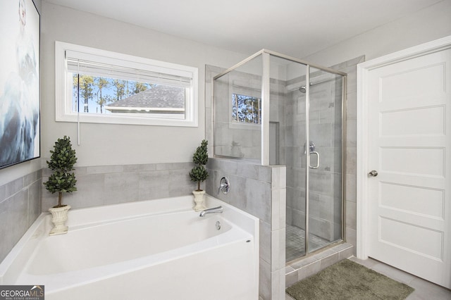 bathroom featuring tile patterned flooring and plus walk in shower