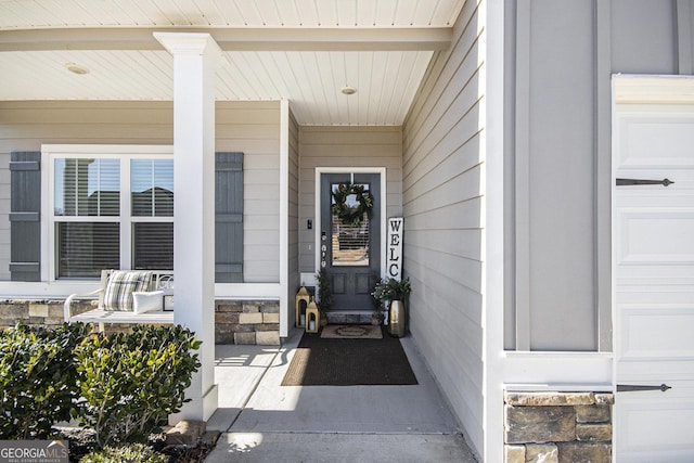 property entrance featuring covered porch