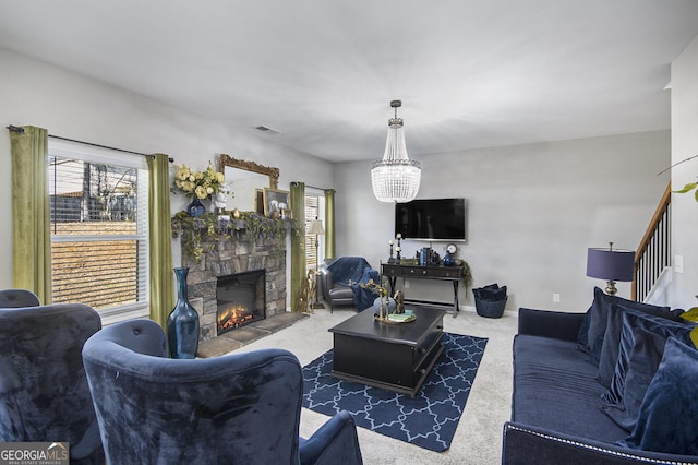 living room featuring a fireplace, an inviting chandelier, and dark carpet