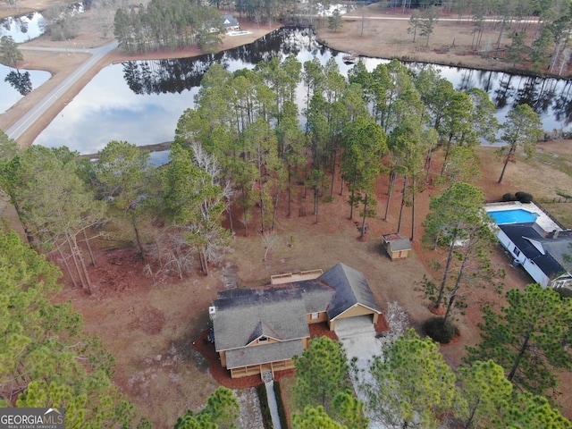 birds eye view of property with a water view