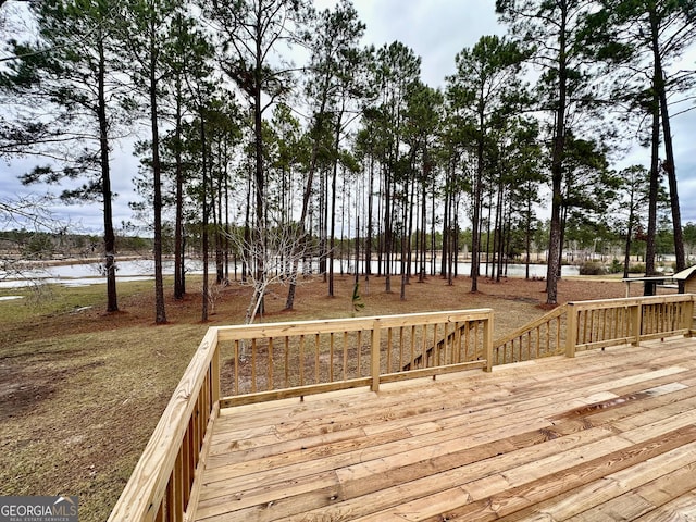 wooden deck with a water view