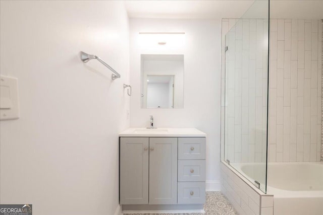 bathroom with vanity and tiled shower / bath combo