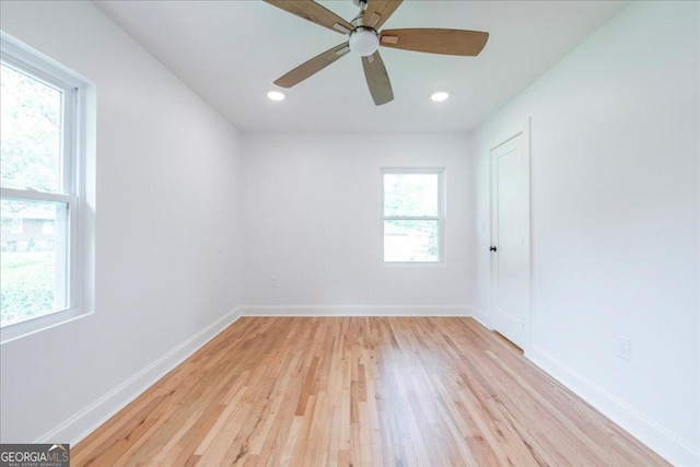 unfurnished room with light hardwood / wood-style flooring and ceiling fan