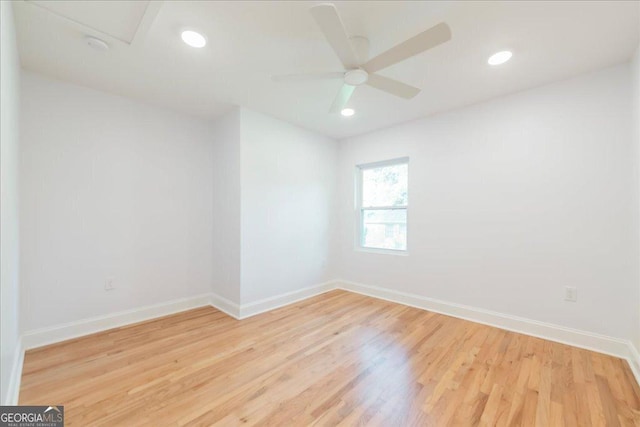 unfurnished room with ceiling fan and light hardwood / wood-style flooring