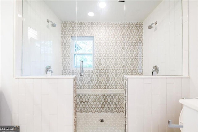 bathroom with a tile shower