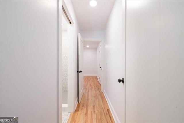 hall with light hardwood / wood-style flooring