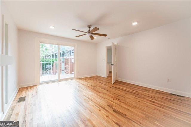 spare room with ceiling fan and light hardwood / wood-style flooring