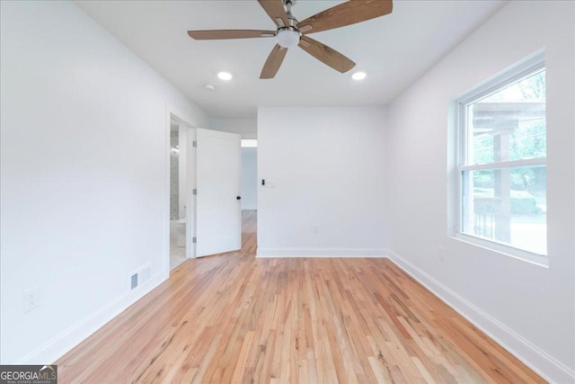 spare room featuring light hardwood / wood-style flooring