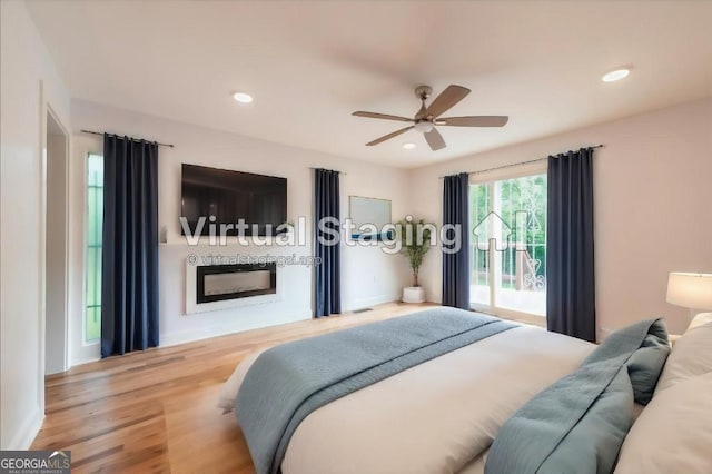 bedroom featuring hardwood / wood-style flooring and ceiling fan