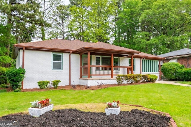 view of front of house featuring a front yard and covered porch