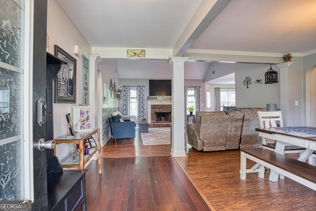 living room with dark hardwood / wood-style flooring and a fireplace