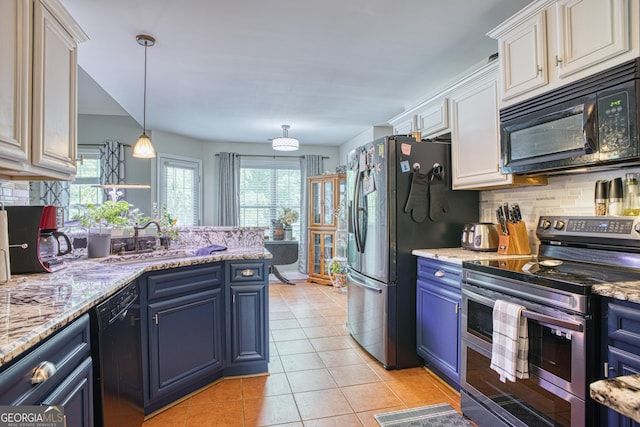 kitchen with black appliances, white cabinets, decorative light fixtures, blue cabinets, and tasteful backsplash