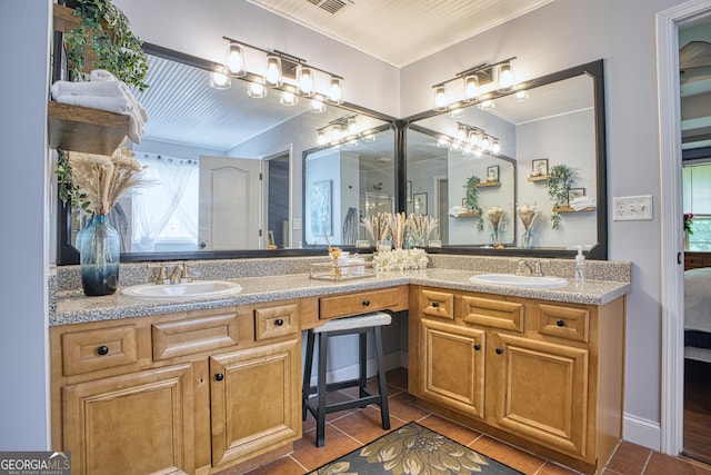 bathroom featuring tile patterned flooring and vanity