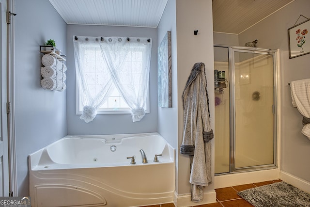 bathroom with separate shower and tub and tile patterned flooring