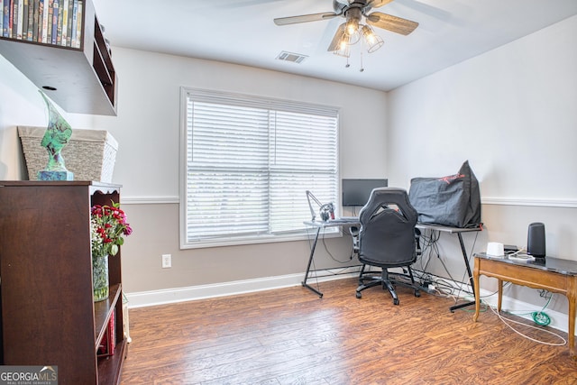 home office featuring ceiling fan and dark hardwood / wood-style flooring