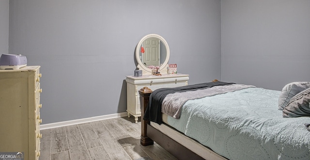 bedroom with light hardwood / wood-style flooring