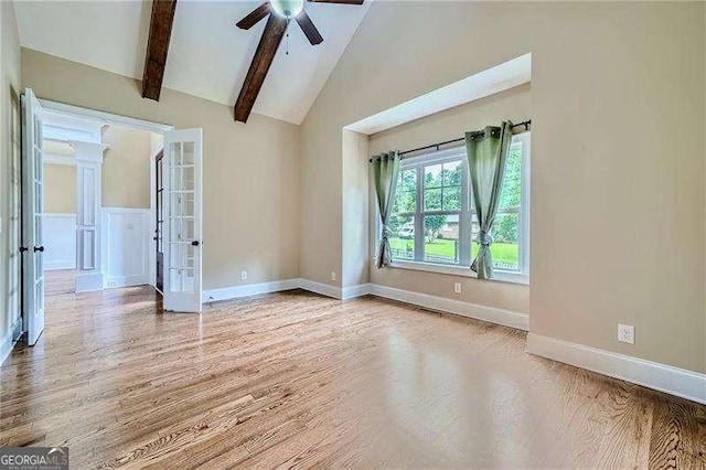 spare room with french doors, high vaulted ceiling, hardwood / wood-style floors, and ceiling fan