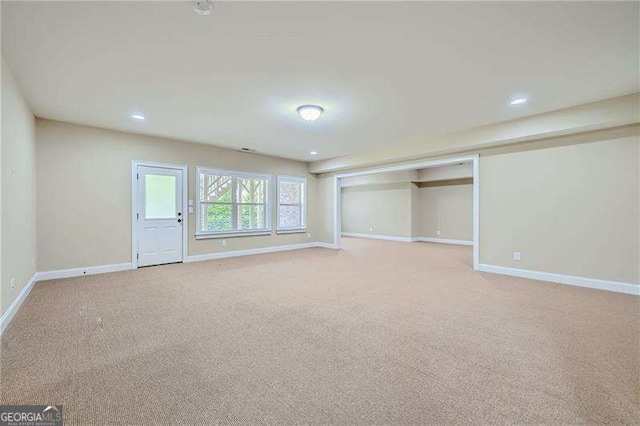 interior space featuring light colored carpet