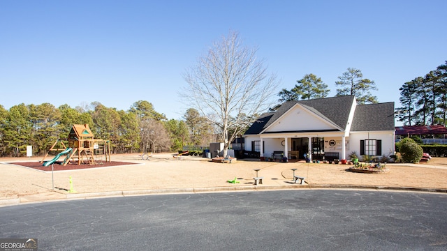 view of front of house featuring a playground