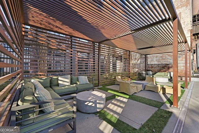 view of patio featuring an outdoor hangout area and a pergola