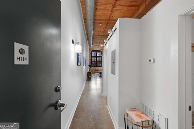 hall featuring electric panel and wood ceiling