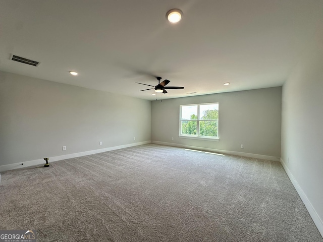 spare room featuring visible vents, a ceiling fan, baseboards, recessed lighting, and carpet flooring