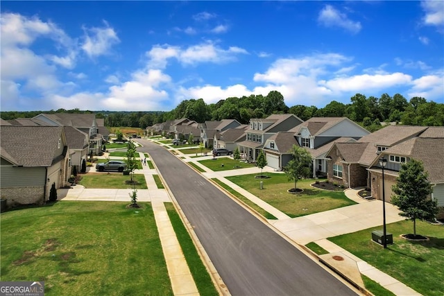 view of road with a residential view, sidewalks, and curbs