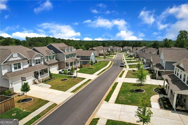 view of street with a residential view, sidewalks, and curbs