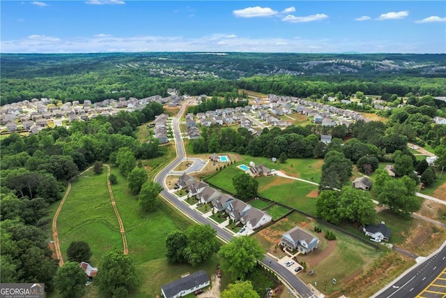 aerial view featuring a residential view and a forest view