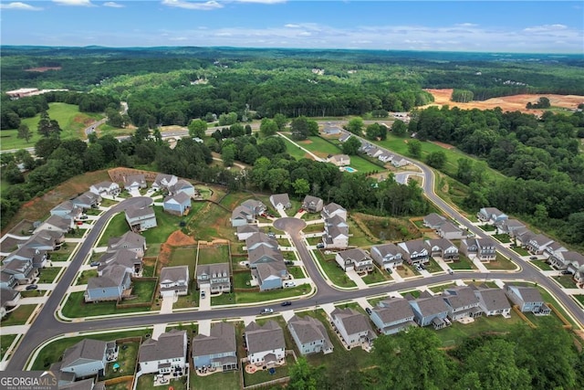 bird's eye view with a residential view and a forest view