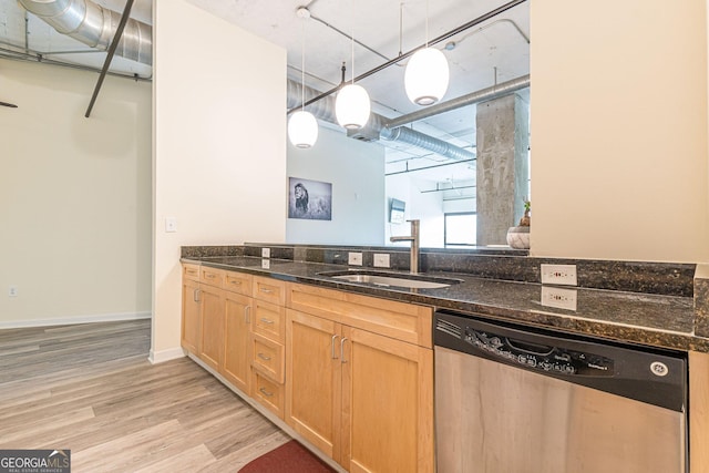 kitchen with dishwasher, sink, hanging light fixtures, light brown cabinets, and light hardwood / wood-style flooring