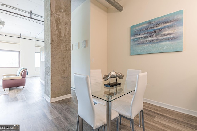 dining area featuring wood-type flooring